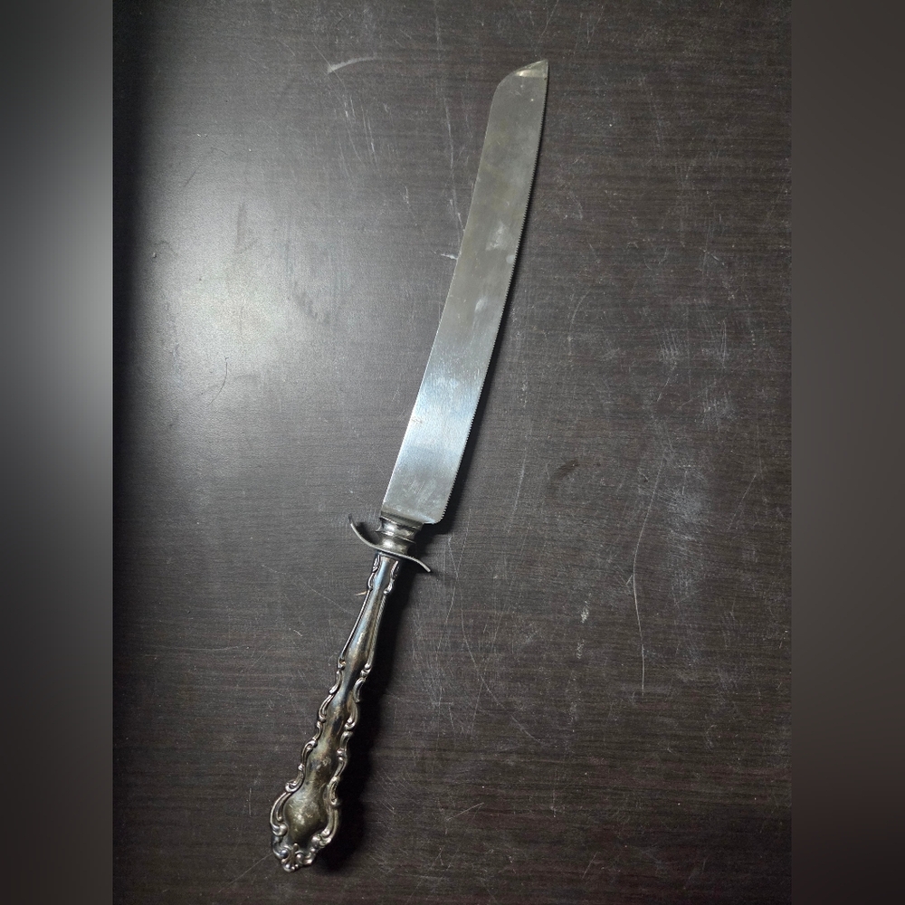 Elegant Silver Serrated Cake Knife